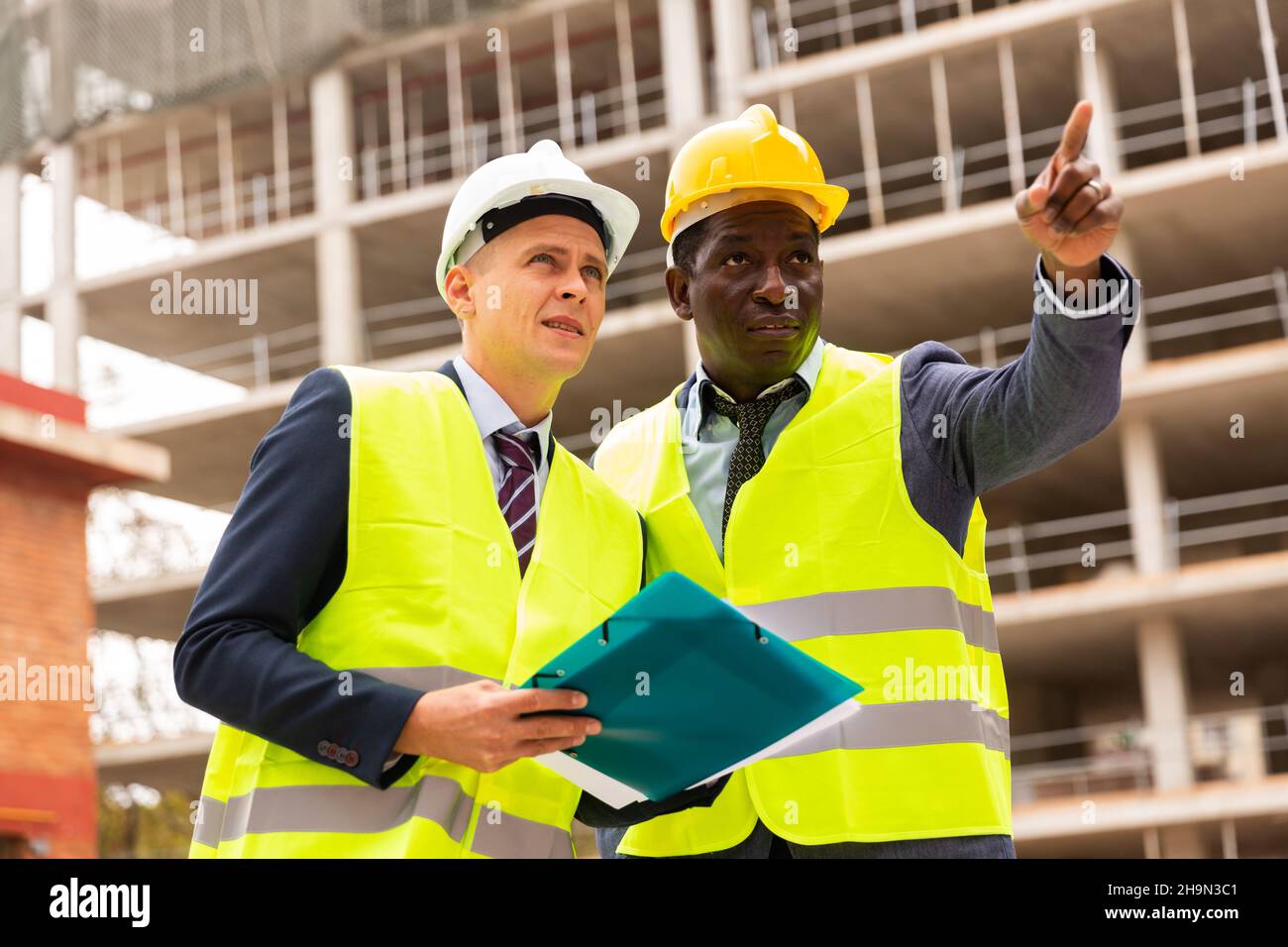 Two architects discussing construction project Stock Photo