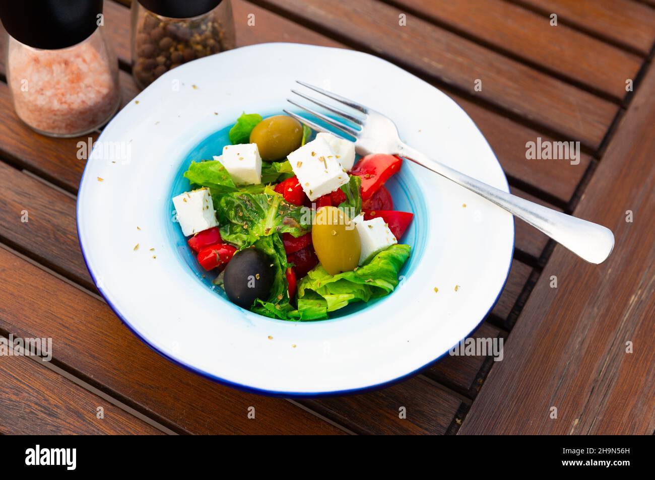 Traditional greek vegetable salad with cheese feta and olives Stock Photo
