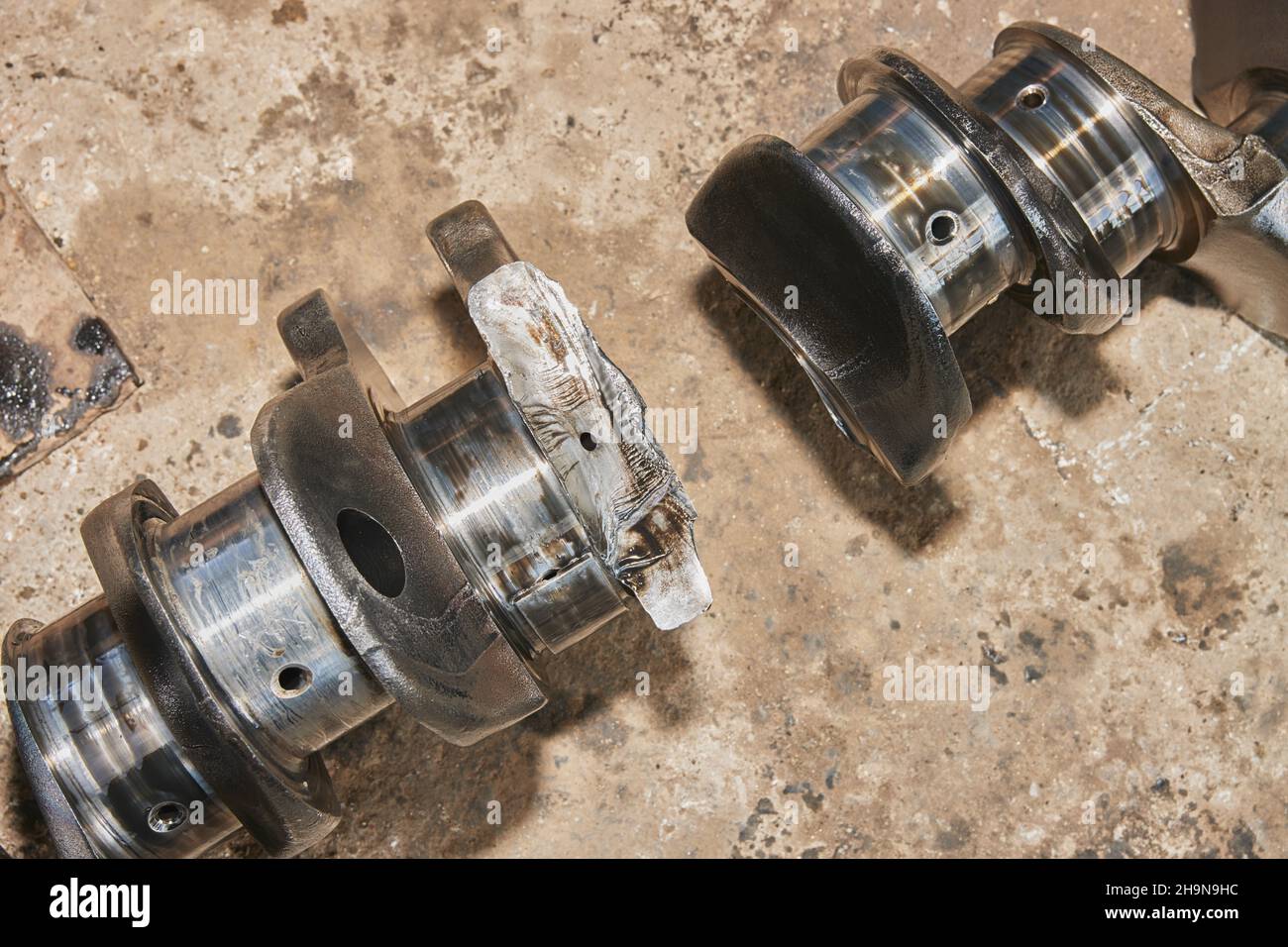 Top View Broken Crankshaft with Engine Oil Stain of Truck Engine on