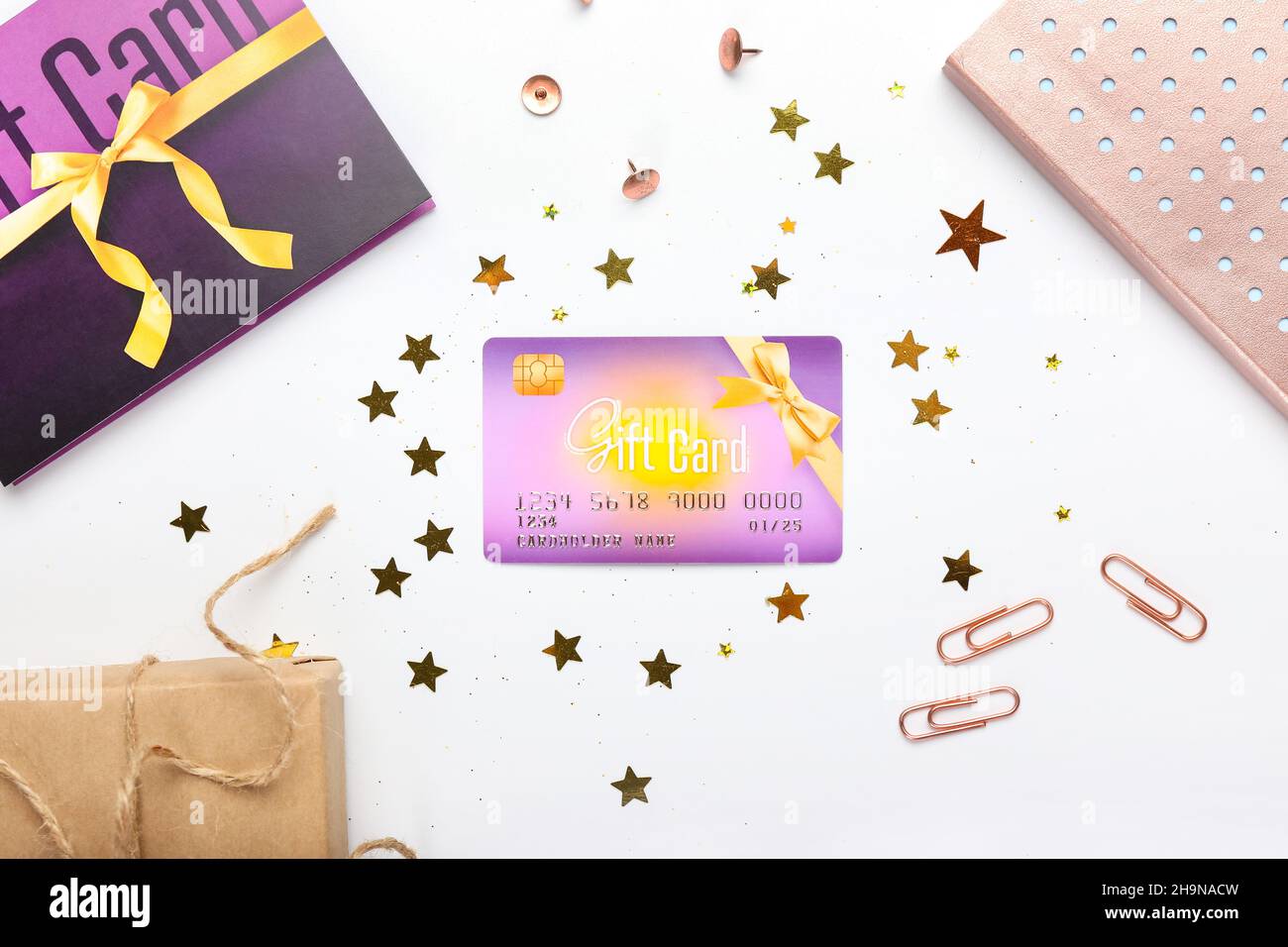Gift card with confetti and stationery on white background Stock Photo ...