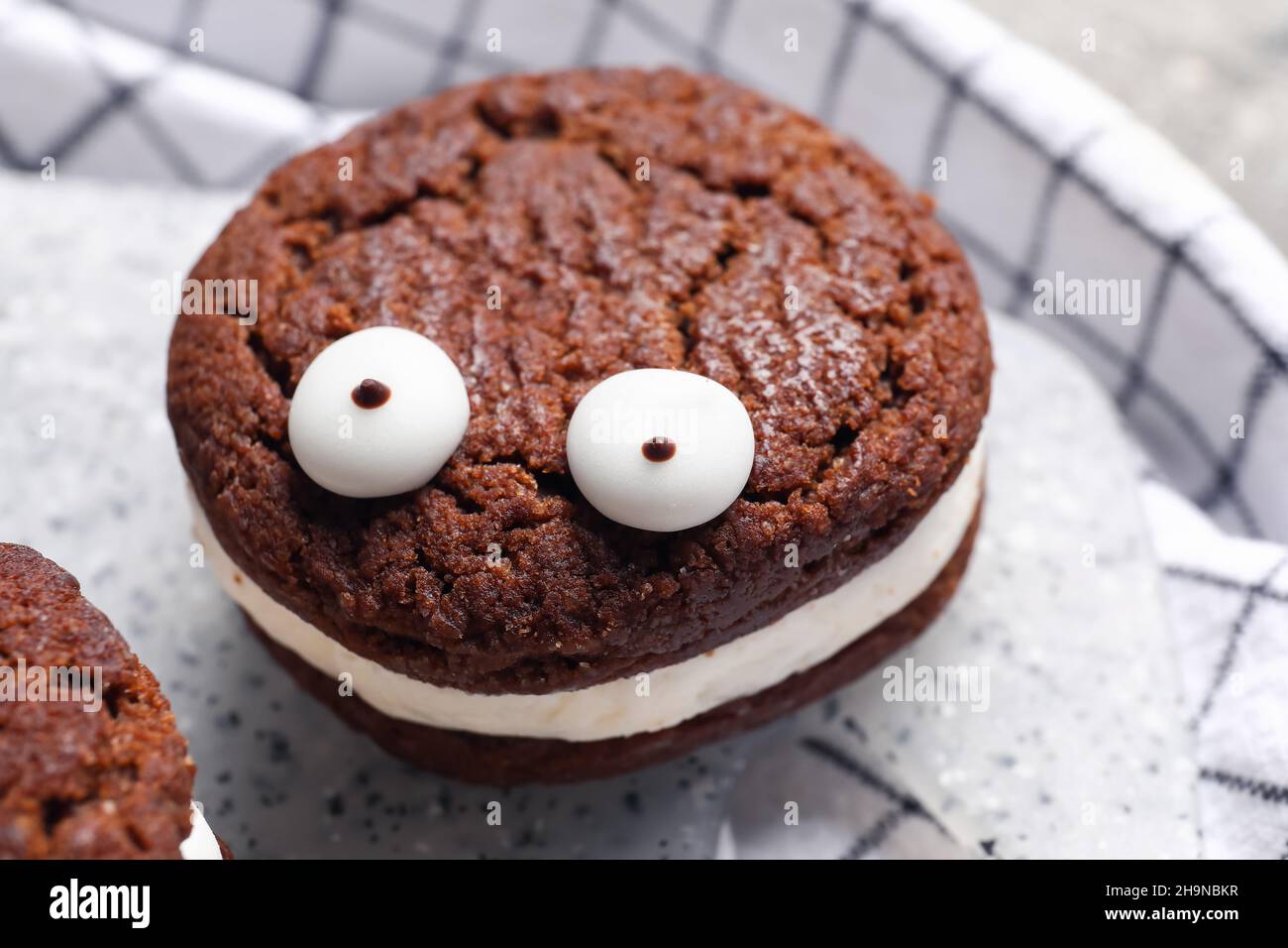 Funny cookie for Halloween on table, closeup Stock Photo