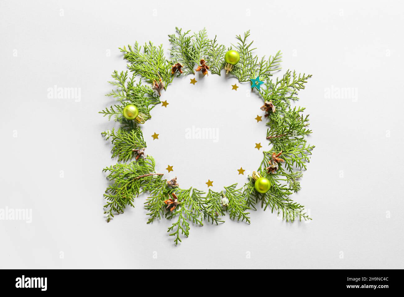 Beautiful wreath made of fir branches and Christmas decor on light ...
