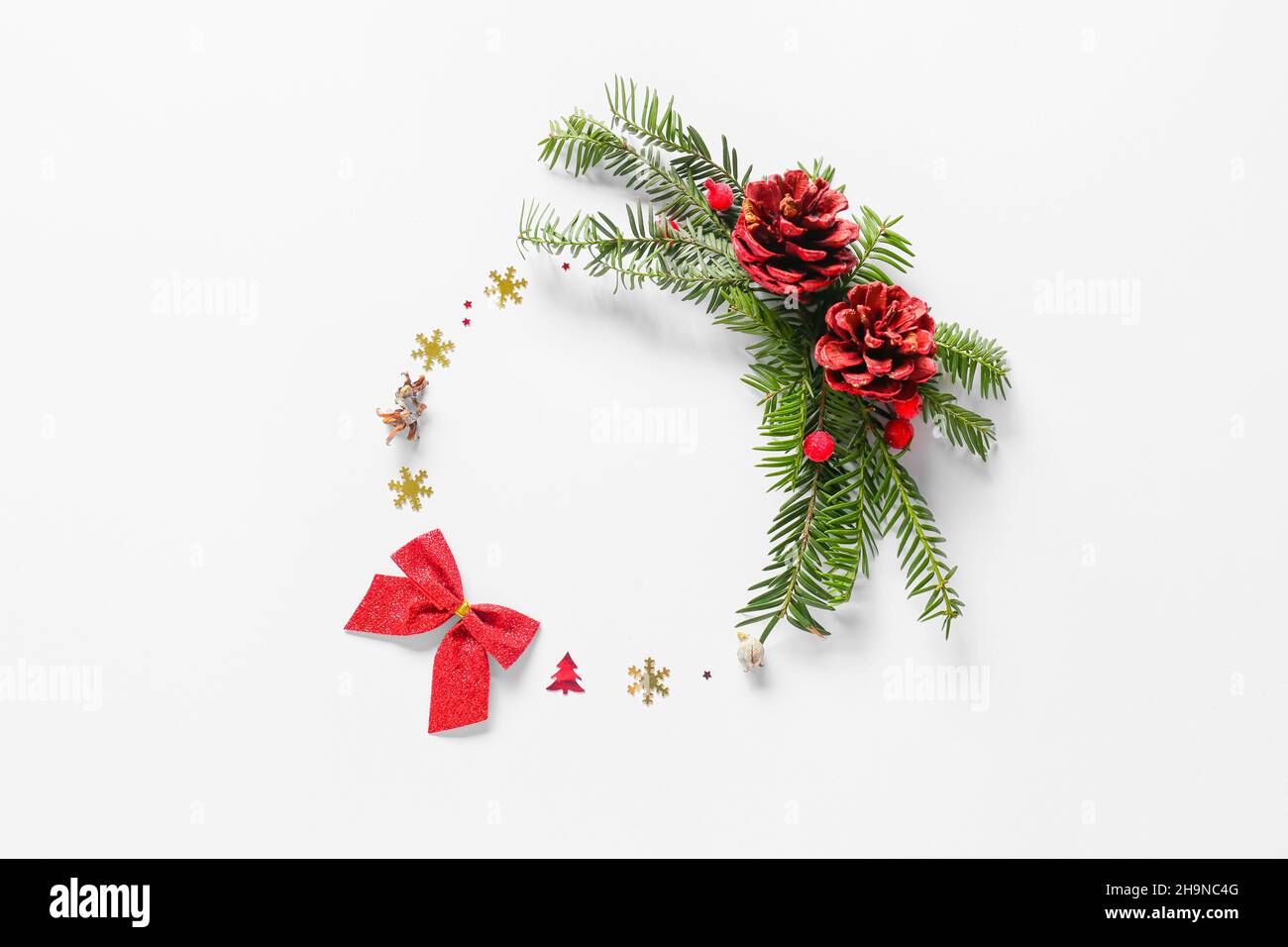 Beautiful wreath made of fir branches and Christmas decor on light ...