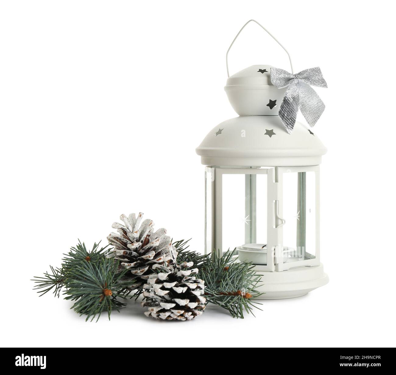 Beautiful Christmas lantern with burning candle, fir branch and pine ...