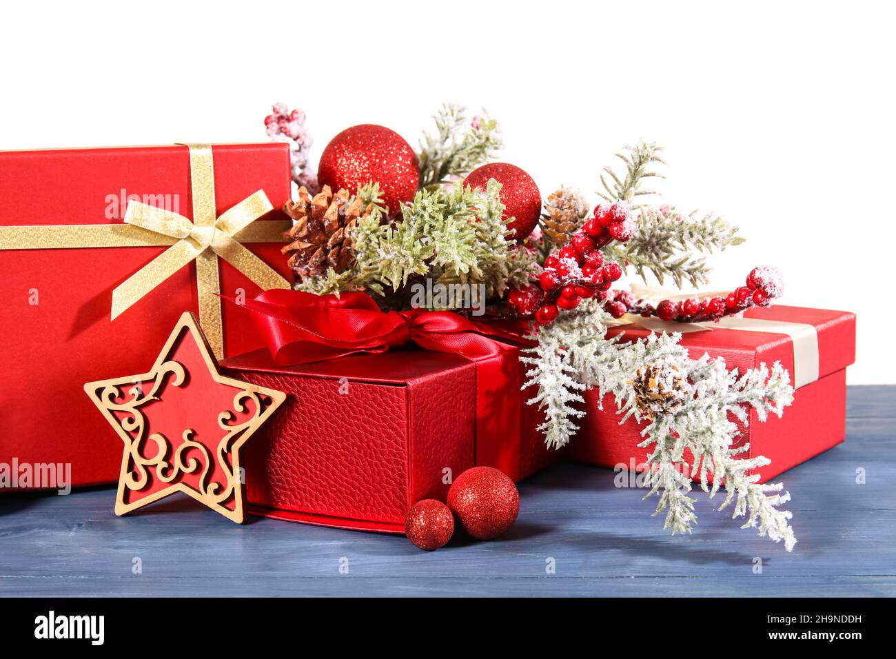Beautiful Christmas composition with gift boxes, decor and fir branches ...