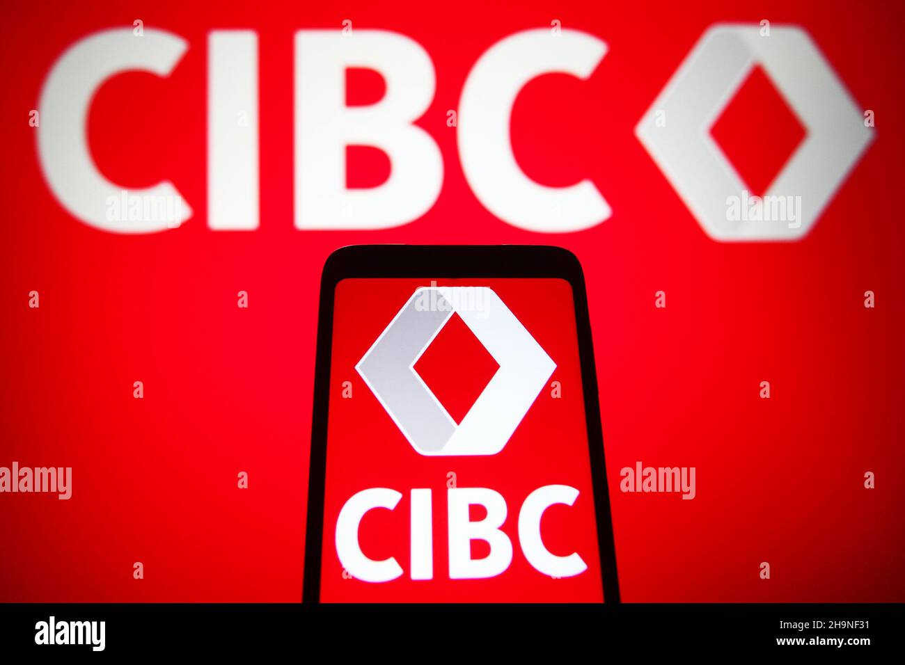 Ukraine. 07th Dec, 2021. In this photo illustration, a Canadian Imperial Bank of Commerce (CIBC) logo is seen on a smartphone and a computer screen. (Photo by Pavlo Gonchar/SOPA Images/Sipa USA) Credit: Sipa USA/Alamy Live News Stock Photo