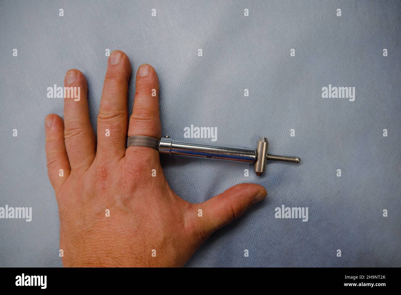 with a surgical finger tourniquet, the blood supply in the finger is