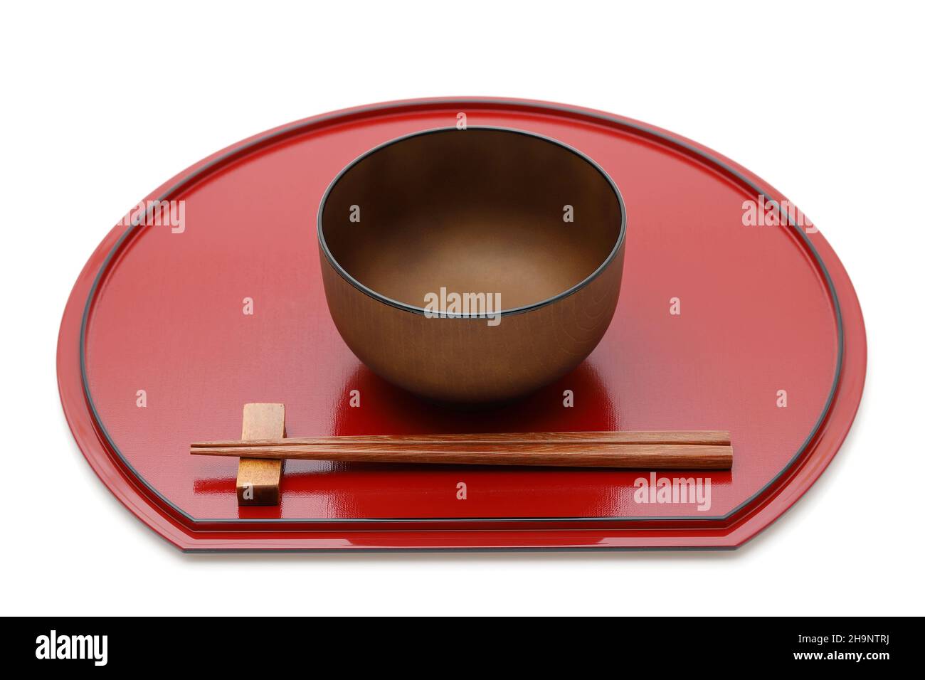Miso soup bowl with chopsticks on tray, Traditional tableware of Japan
