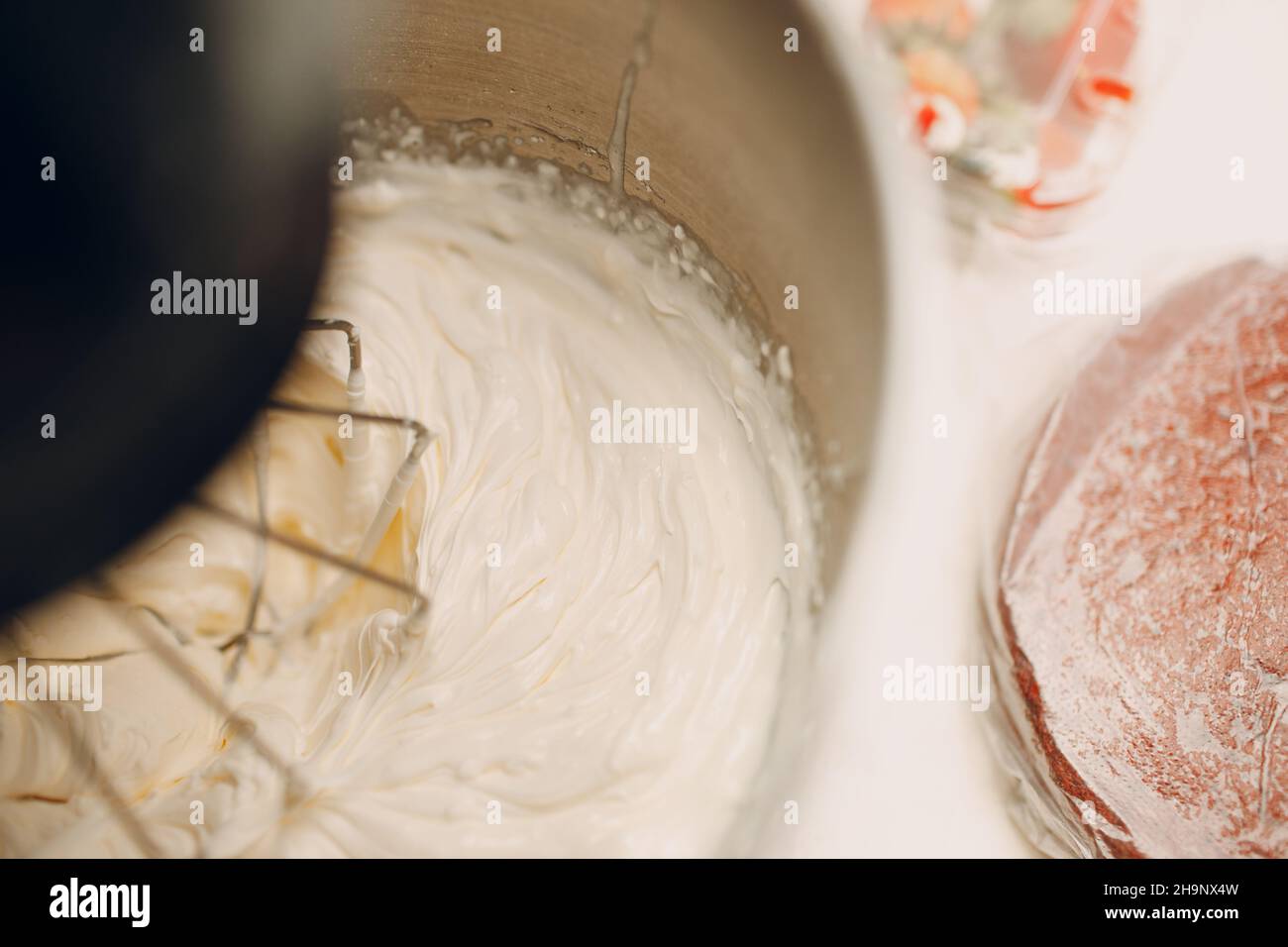 Pastry chef makes cake and making cream on blender. Cooking and