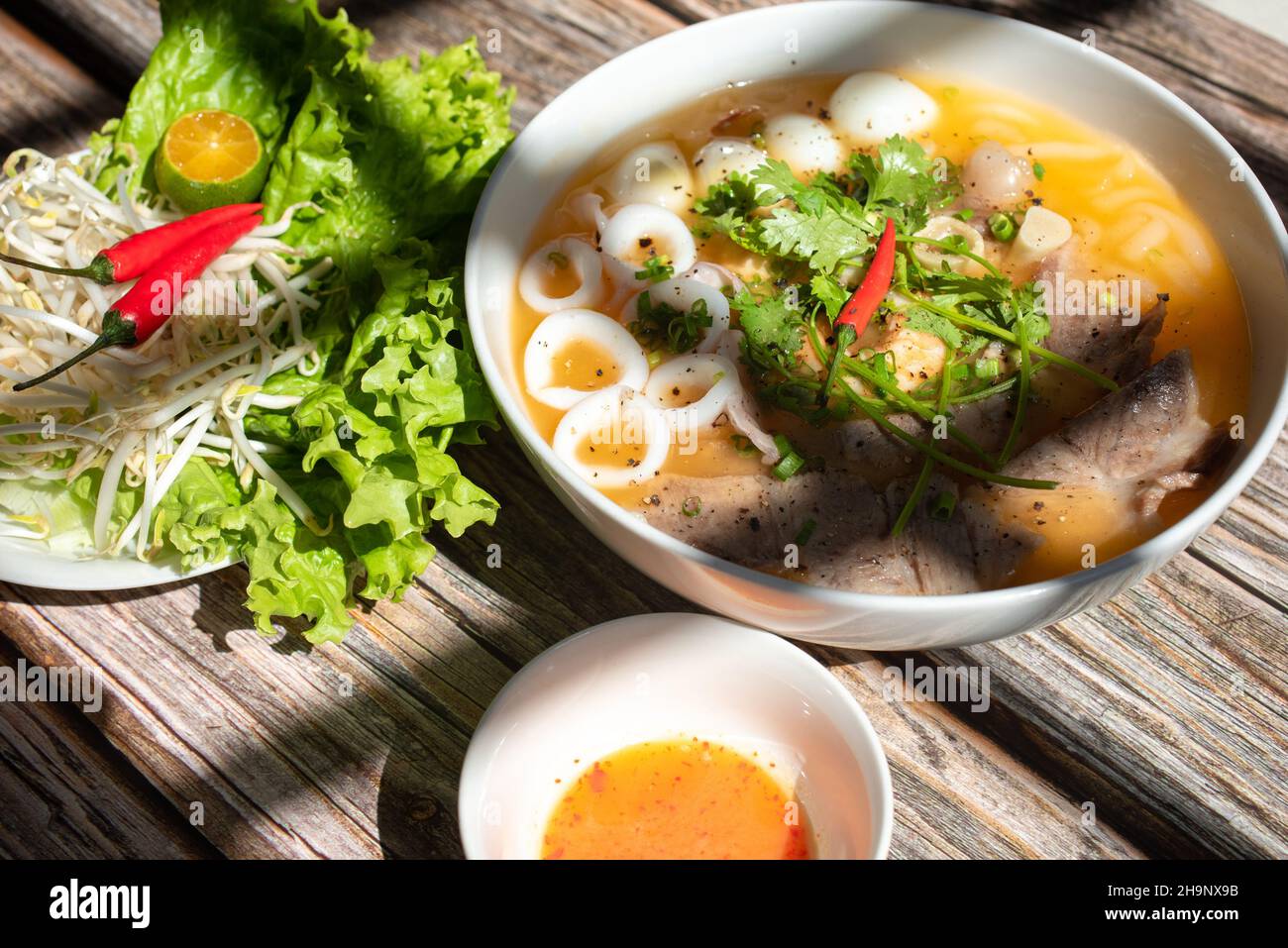 Banh Canh is a very popular food in Vietnam. The ingredients include pig's trotters, seafood, eggs and vegetables, but the main ingredient is rice noo Stock Photo