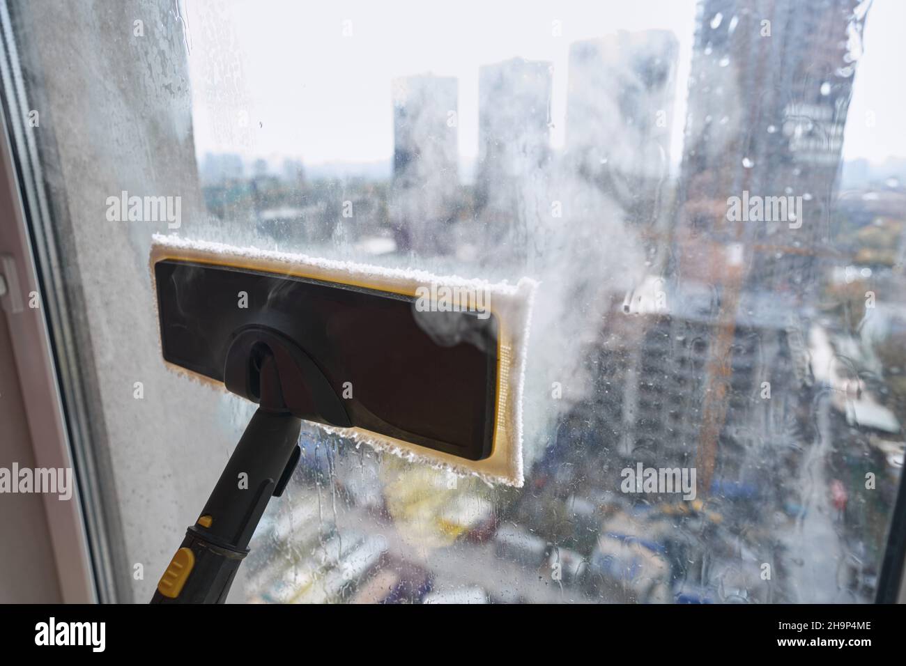 Steam Cleaning Windows with Pressure Editorial Photography - Image