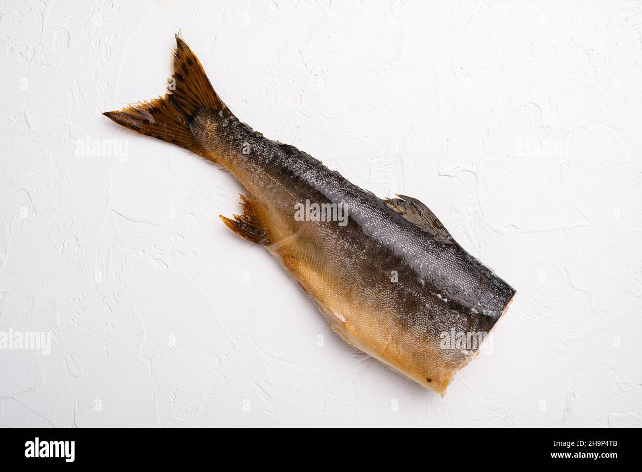 Whole hot smoked fish set, on white stone table background, top view ...
