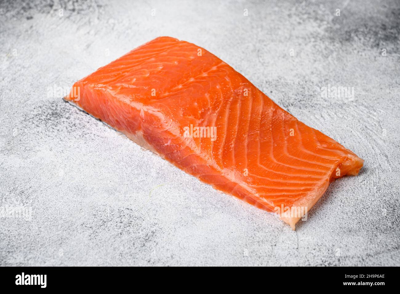 Fresh raw salmon set, on gray stone table background, with copy space ...