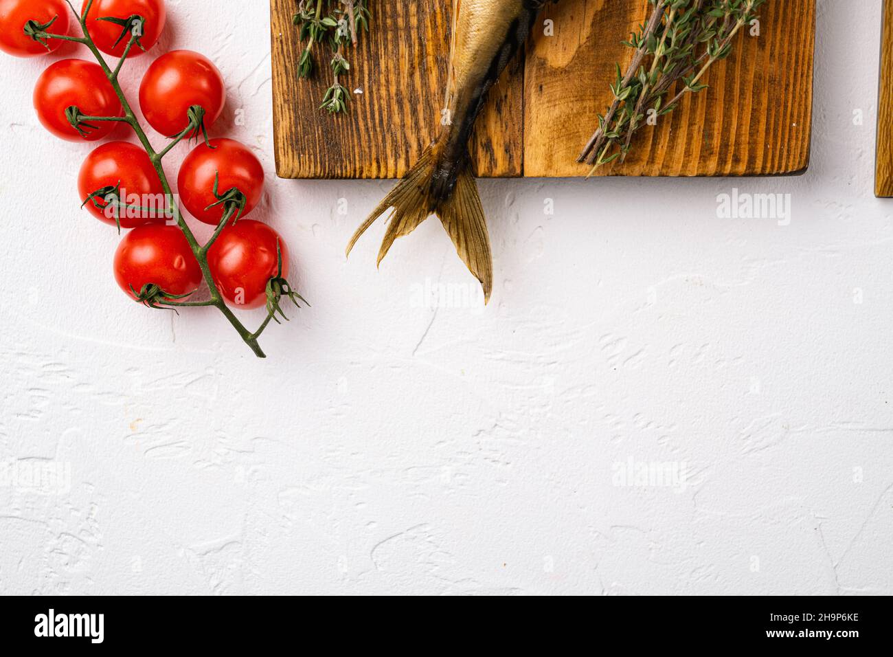 Smoked fish set, on white stone table background, top view flat lay ...