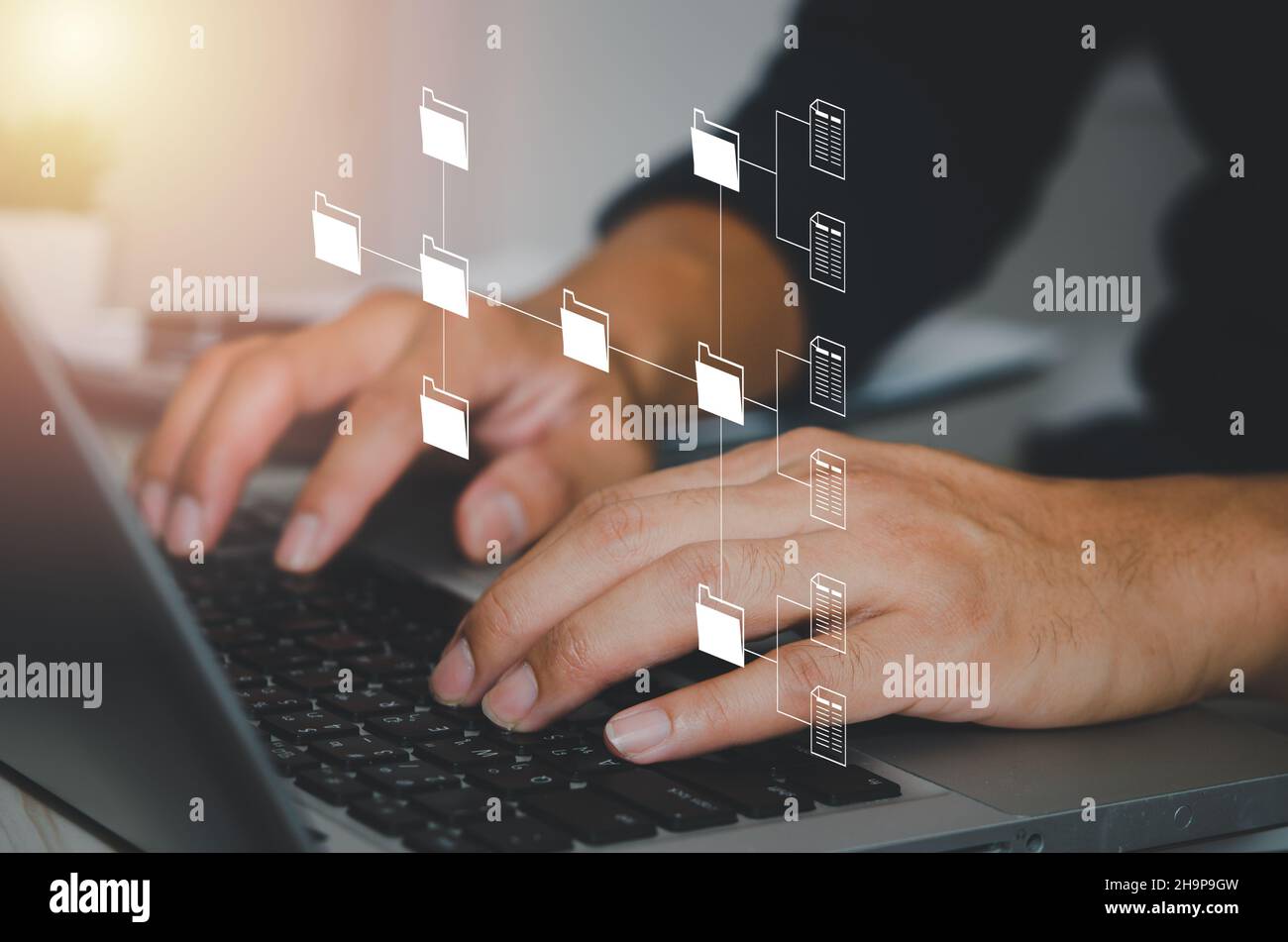 Document Management System (DMS). Businessman work on laptop online documentation database corporate. Stock Photo