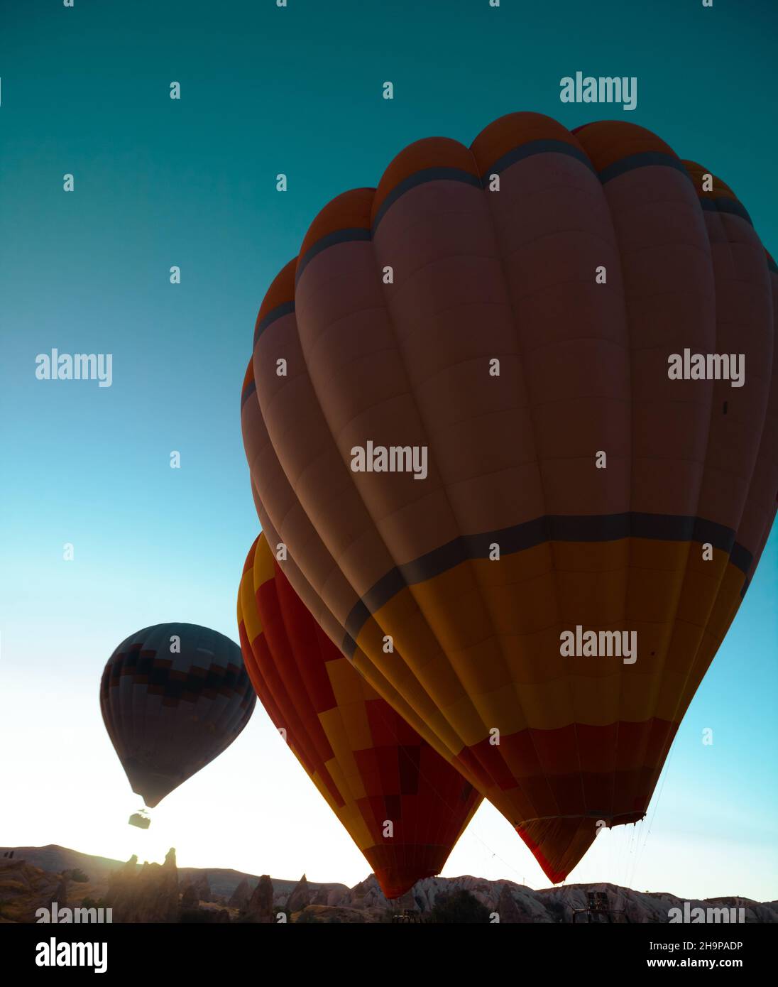 Hot air balloons. Hot air balloons ready to take off in the sunrise