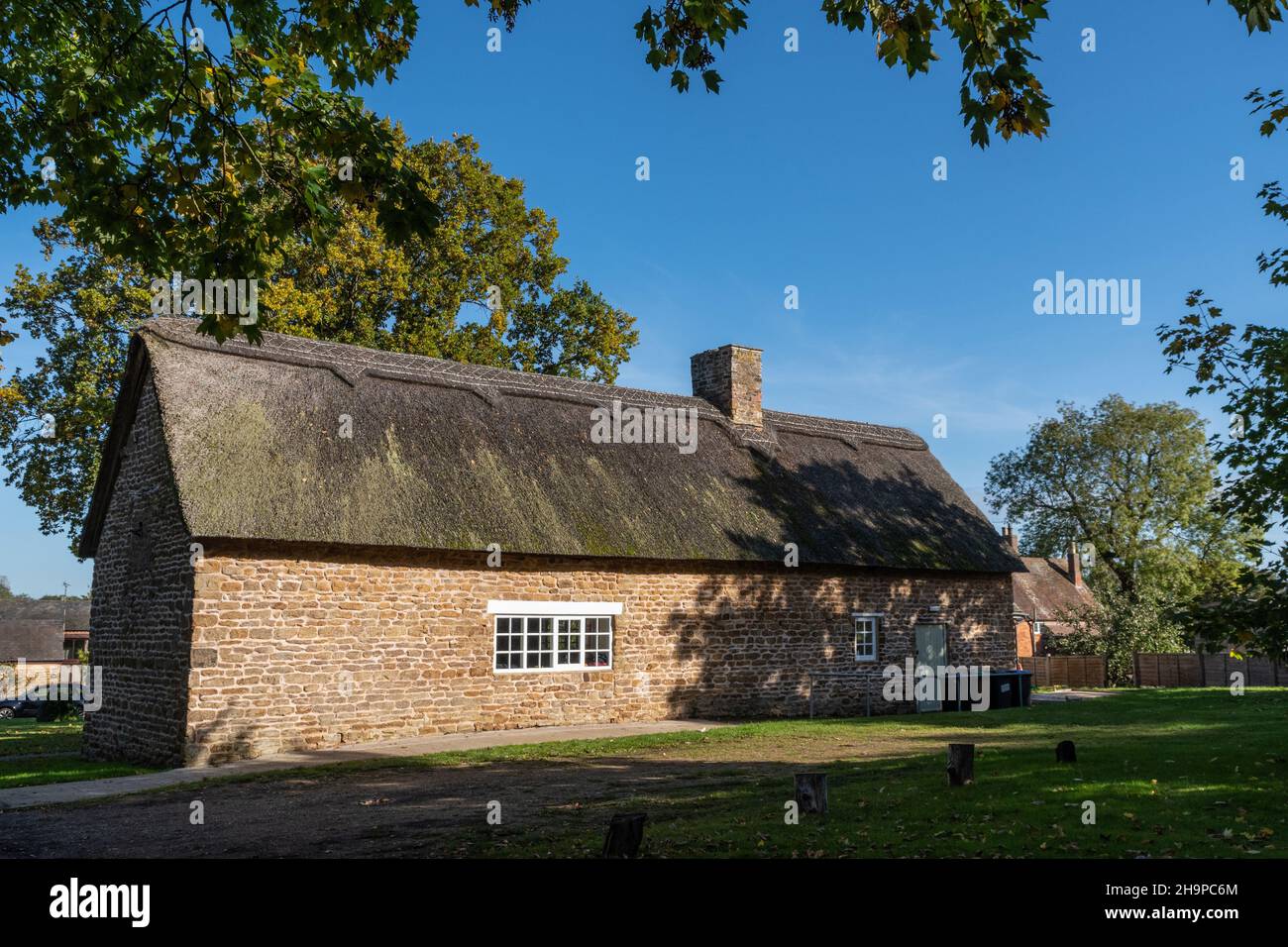 The Village Hall, a stone built thatched building, Ashby St Ledgers, Northamptonshire, UK Stock Photo