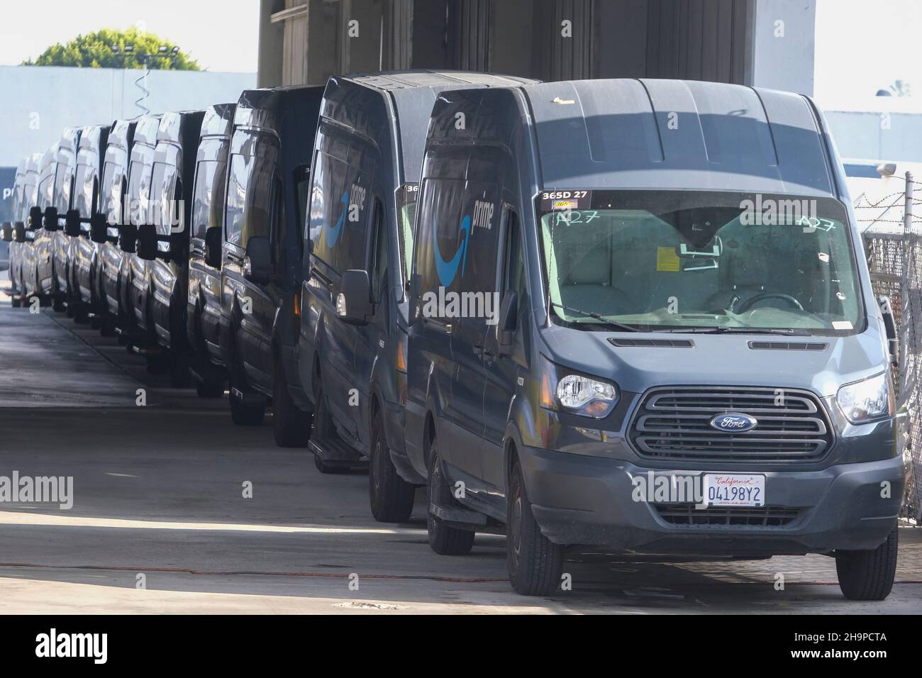 Los Angeles, California, USA. 7th Dec, 2021. Amazon delivery vans are