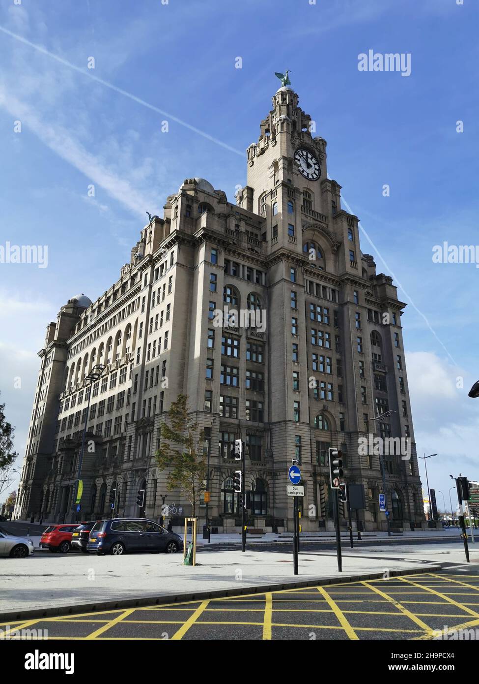 Facade of the Royal Liver Building in Liverpool against a blue cloudy ...