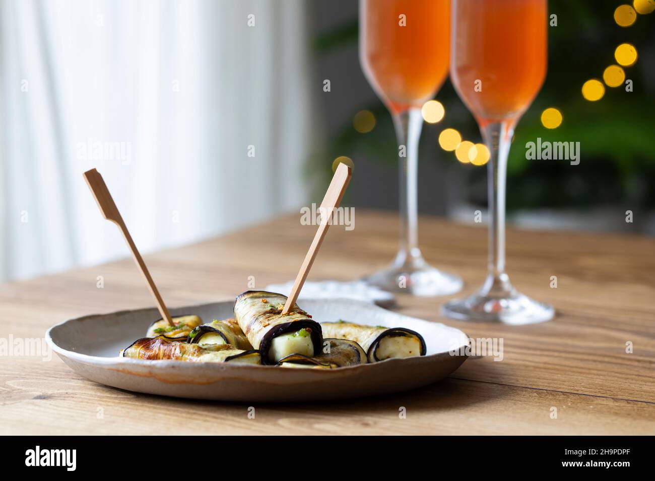 Vegetarian canapes of halloumi cheese wrapped in grilled aubergine Stock Photo
