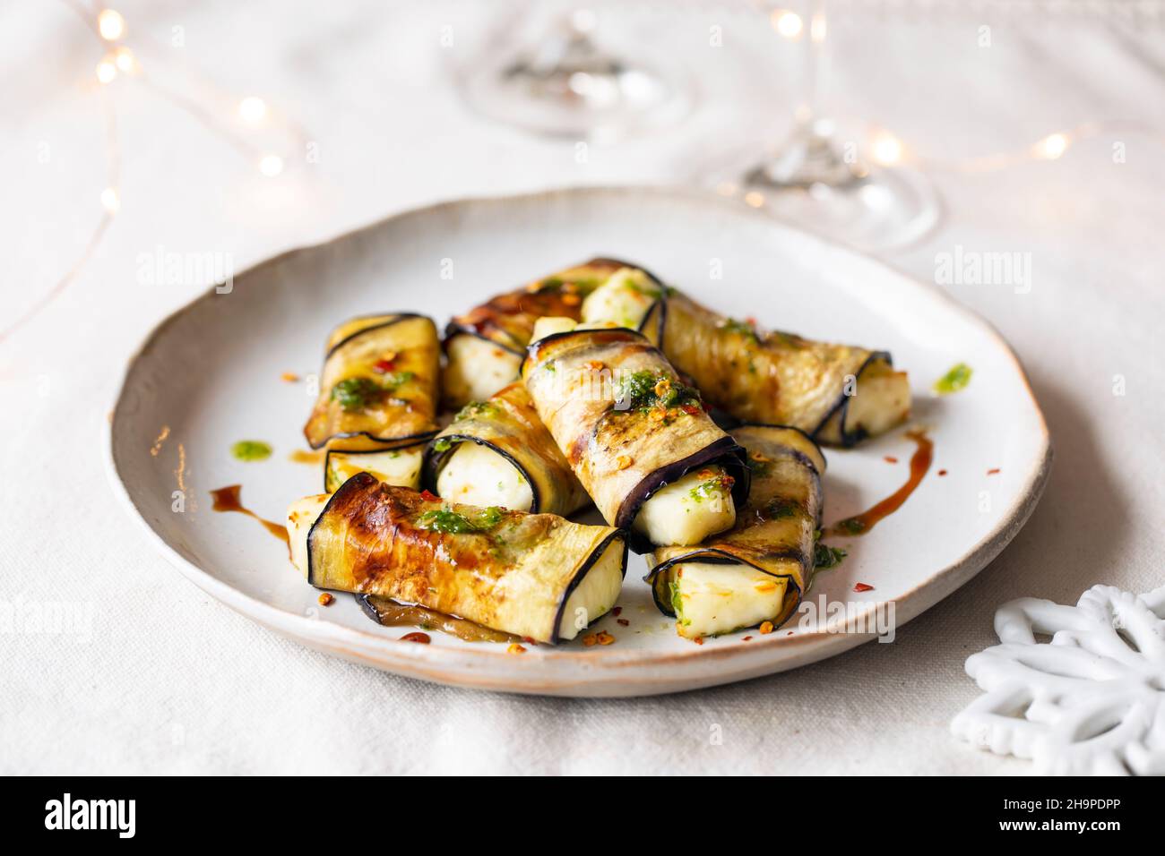 Vegetarian canapes of halloumi cheese wrapped in grilled aubergine Stock Photo