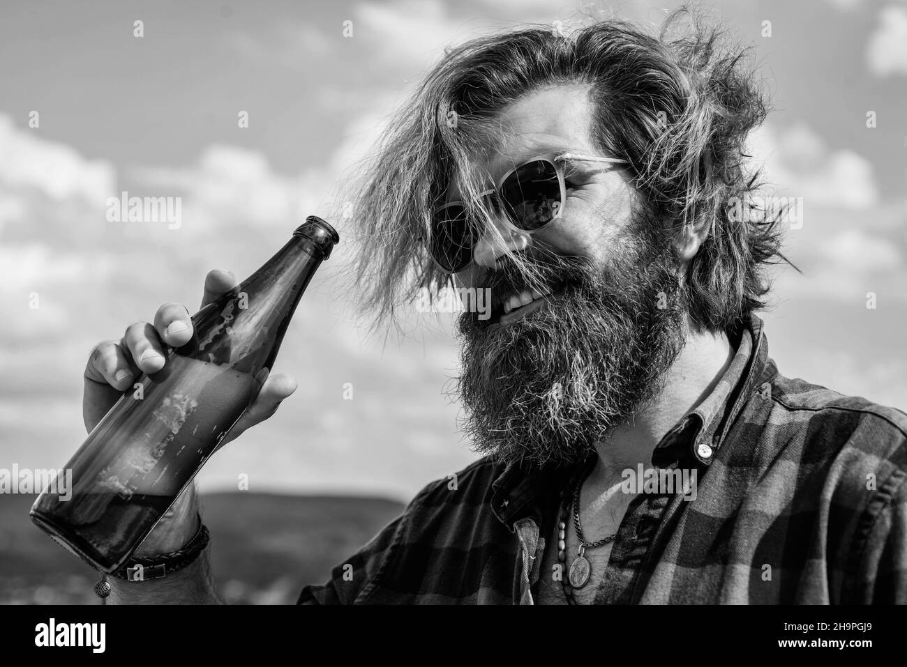 cheers. water balance in body. stay hydrated. relax and refreshment. modern looking bearded hipster drink beer. alcohol concept. thirsty brutal Stock Photo