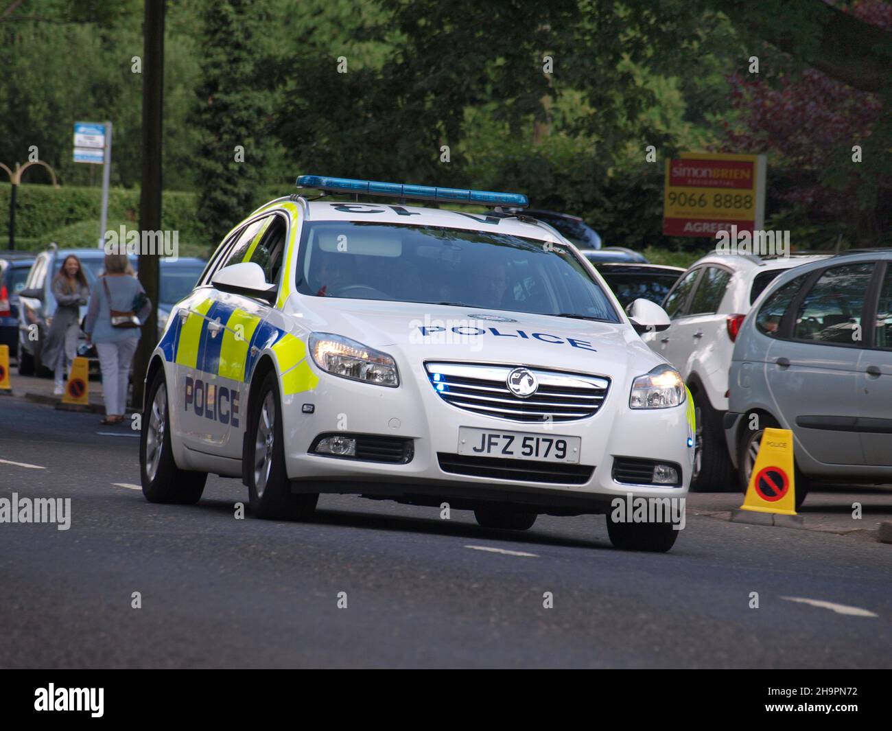 Police prepare for the 2017 12th July celebrations in Hillsborough, Northern Ireland in a 2013 model Vauxhall Insignia Stock Photo