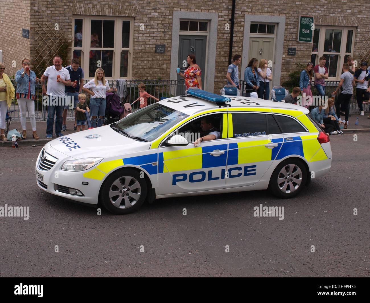 Police prepare for the 2017 12th July celebrations in Hillsborough, Northern Ireland in a 2013 model Vauxhall Insignia Stock Photo