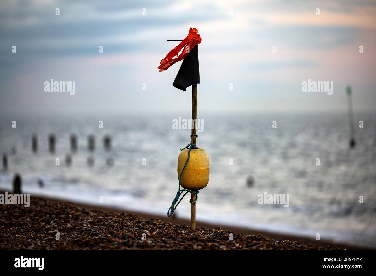 Lobster pot marker post washed up on the beach, Bawdsey Ferry, Suffolk, England. Stock Photo