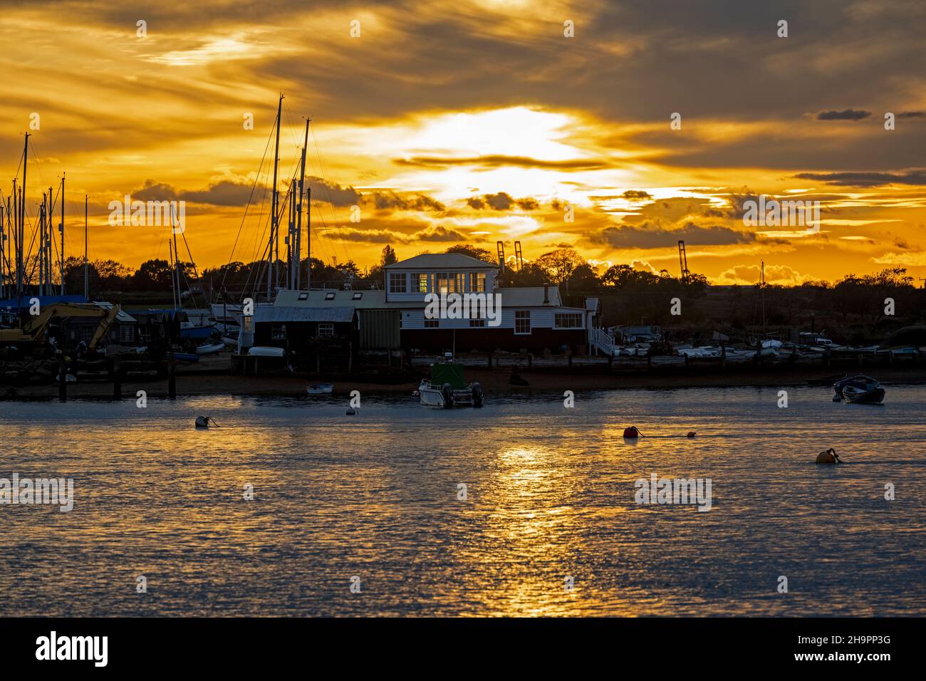 Sunset over the river Deben Felixstowe Ferry Suffolk England Stock Photo