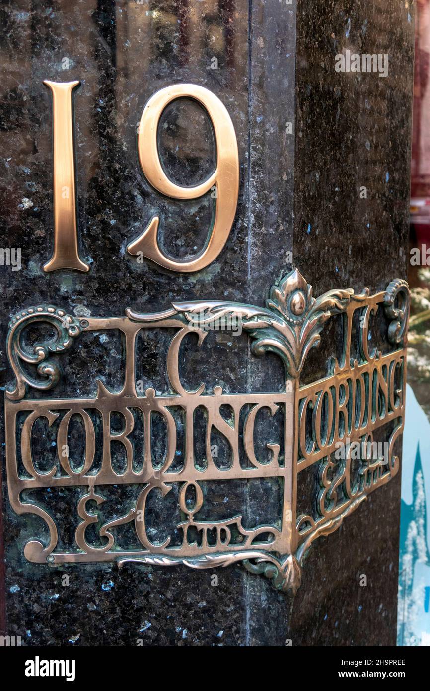 UK, England, London, Piccadilly, Cordings Gent’s Outfitters established 1836, brass sign at door Stock Photo