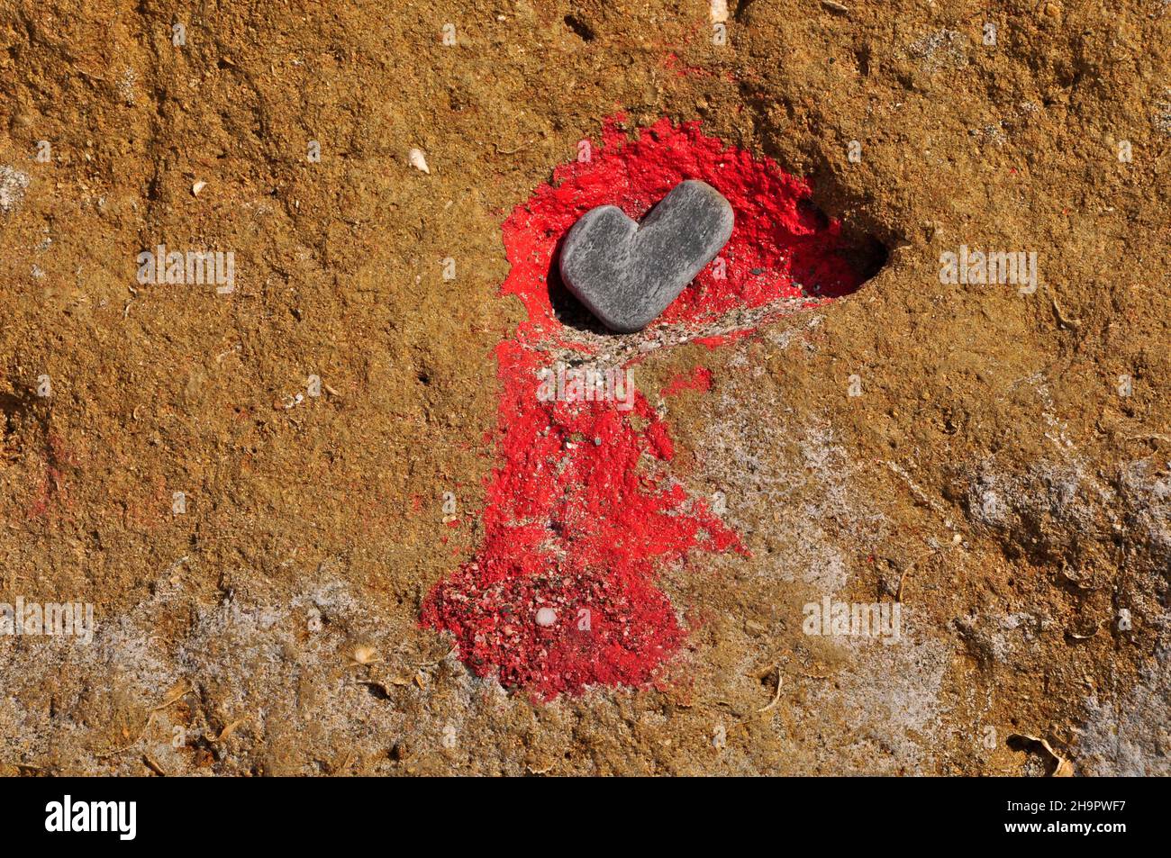 Stone as heart symbol in rocks with red colour, heart shape, symbol of love, sign of love, love symbol, heart of nature, natural heart, proof of Stock Photo
