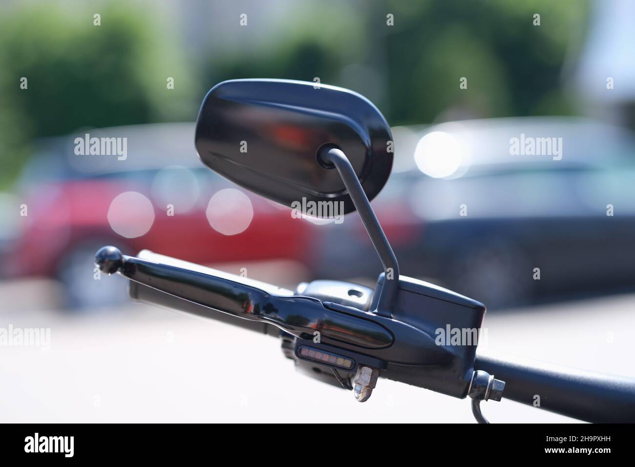 Steering wheel and part of braking system from motorcycle with mirror Stock Photo