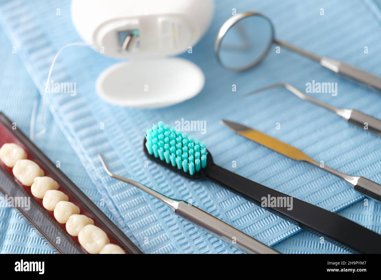Dental instrument dental floss and dental implants closeup Stock Photo