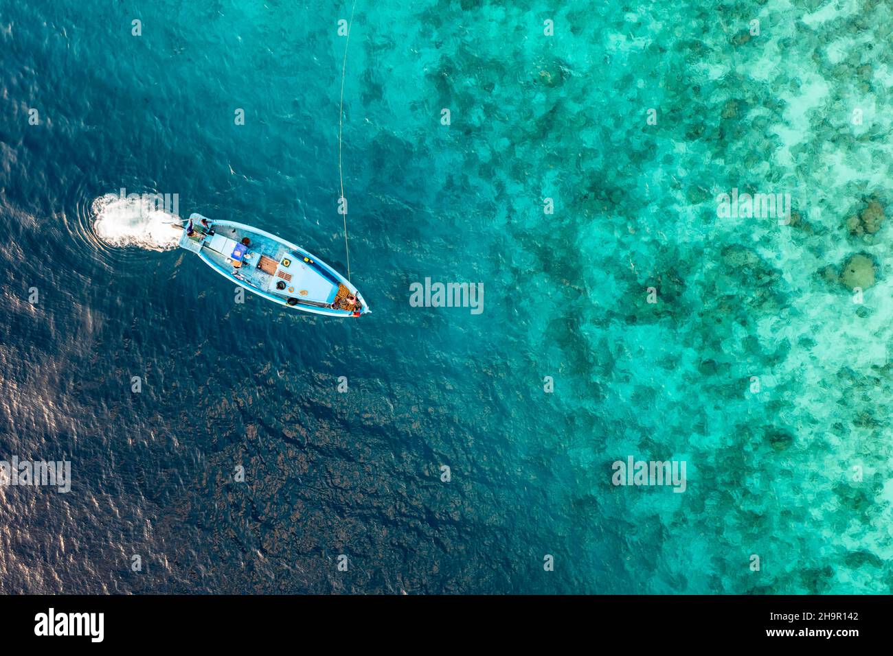 Aerial view, small fishing boat on a reef, Laviyani Atoll, Maldives, Indian Ocean Stock Photo