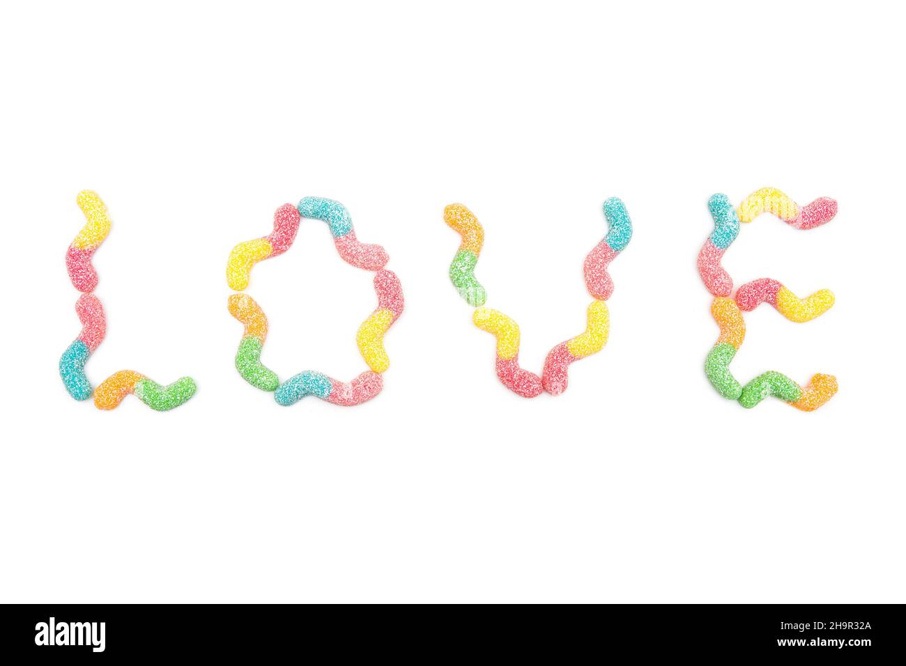 Word LOVE made from multicolored gummy worms isolated on white background Stock Photo