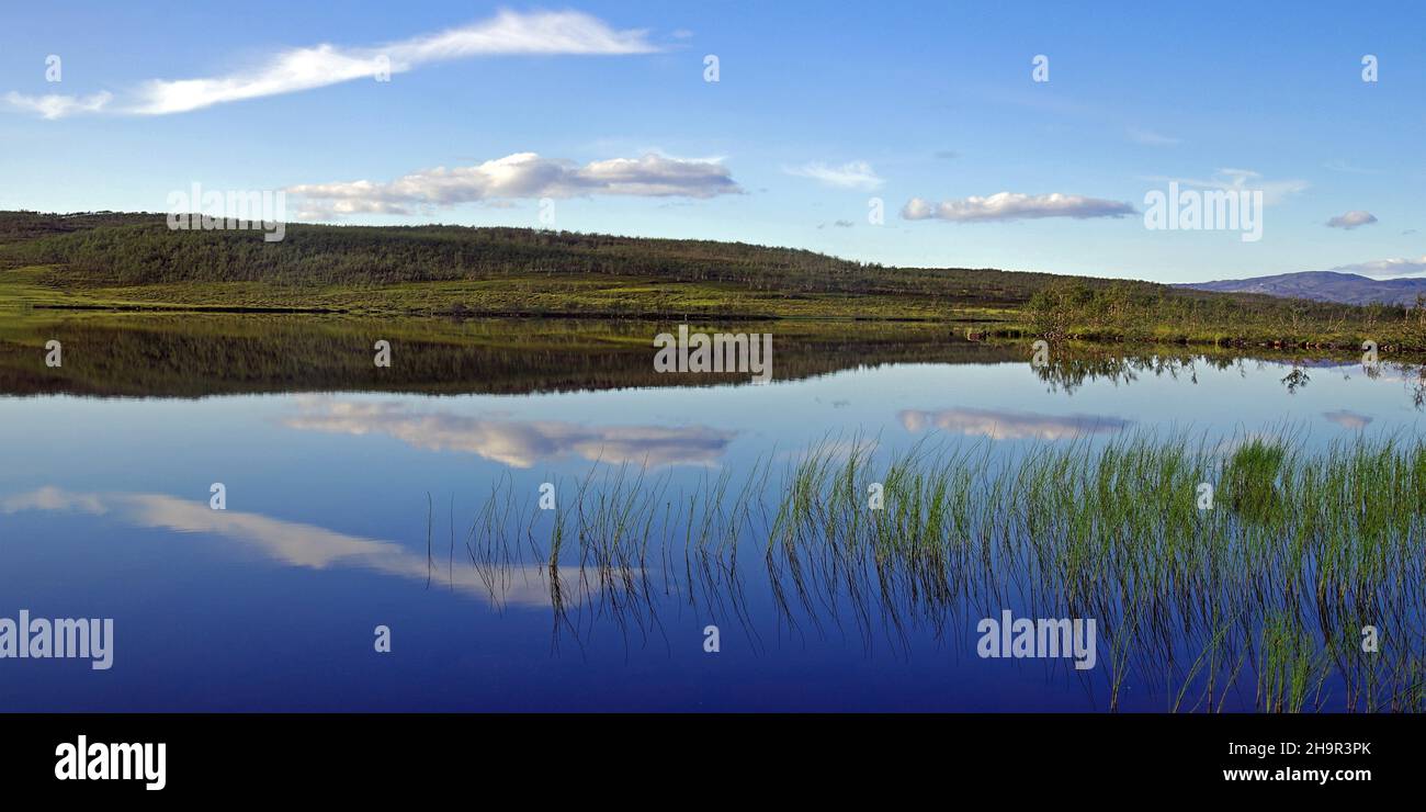 Clouds, calm lakeland landscape, late summer, Finnmark, Norway Stock Photo