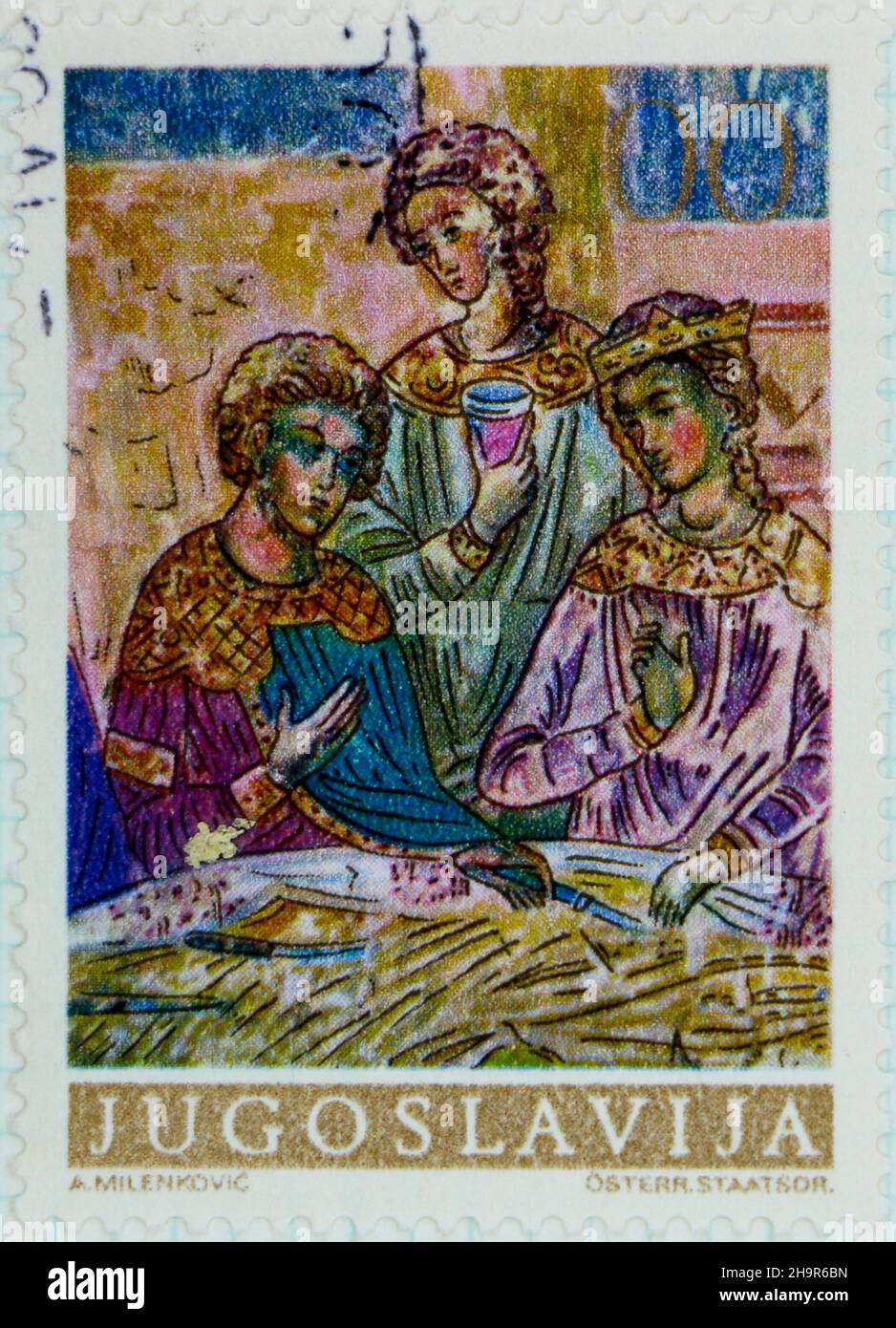 Photo of a 10 dinar postage stamp from Yugoslavia with three painted figures Stock Photo