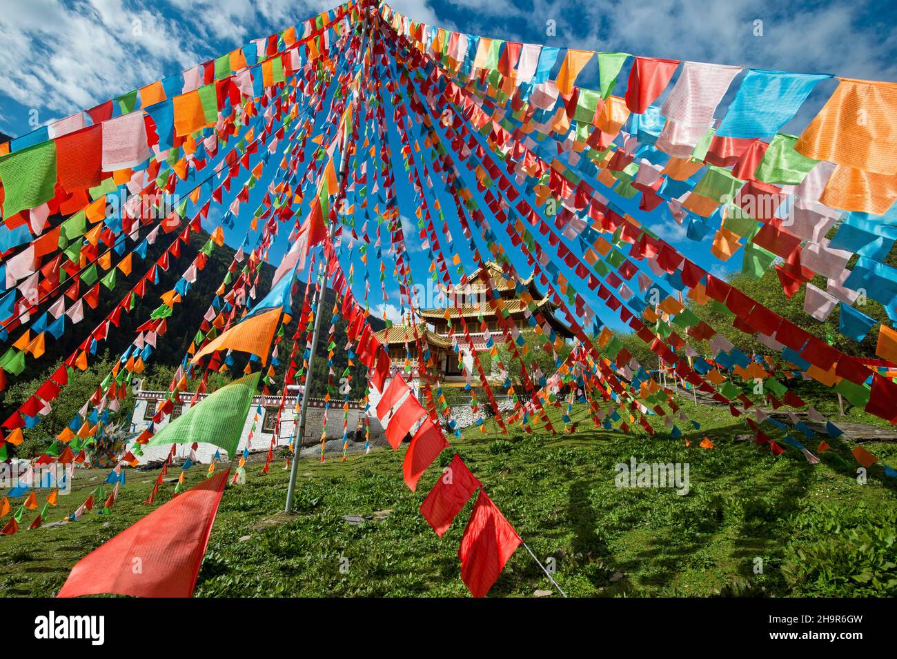 Tibetan Buddhism, prayer flags at a Tibetan monastery in Mount Siguniang Nature Preserve, Rilong, Ngawa Tibetan Autonomous Prefecture, Sichuan, China Stock Photo