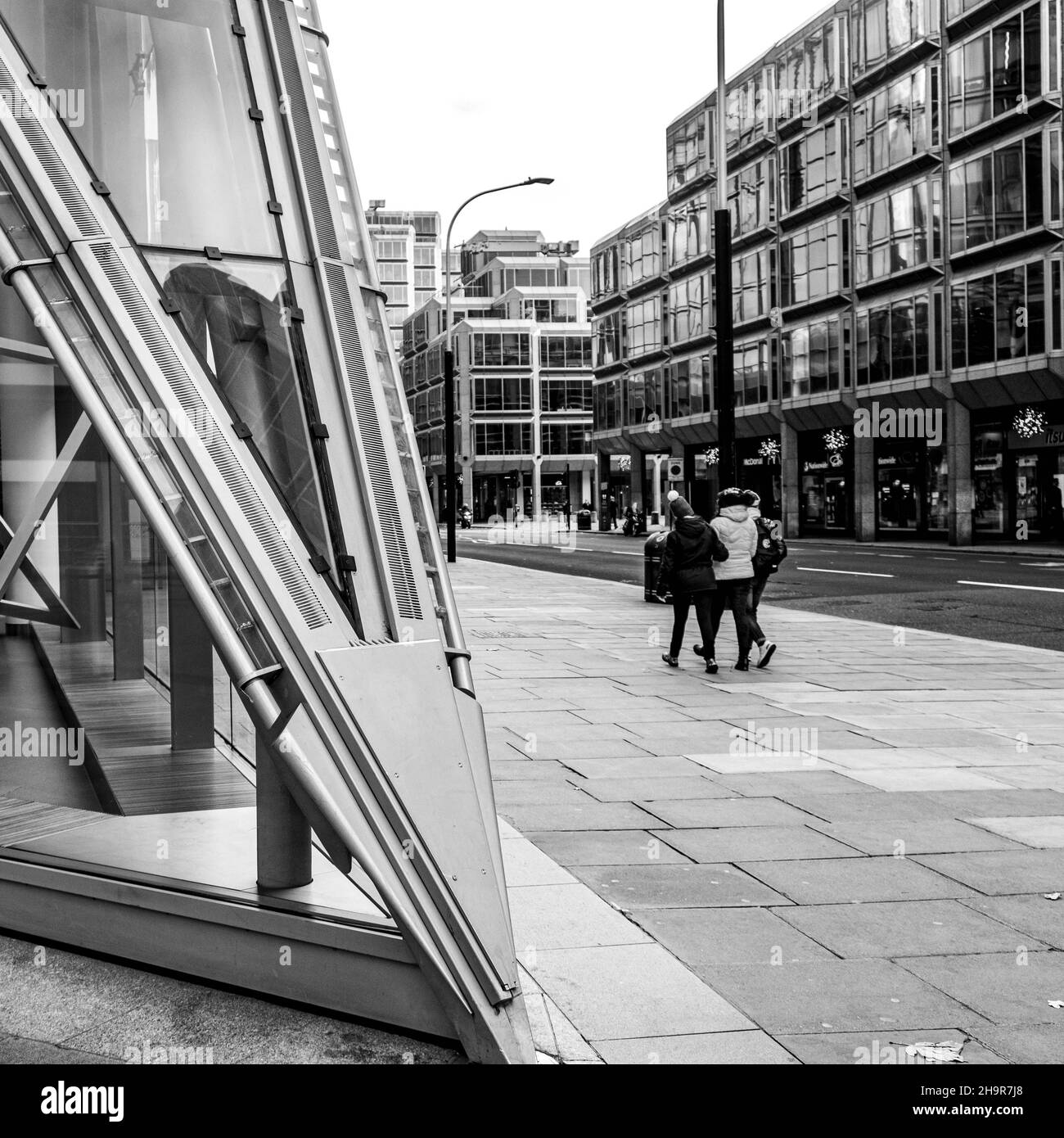 Central London UK November 21 2021, Small Group Of People Walking Past Cardinal Place Victoria Street London Architectural Feature Stock Photo