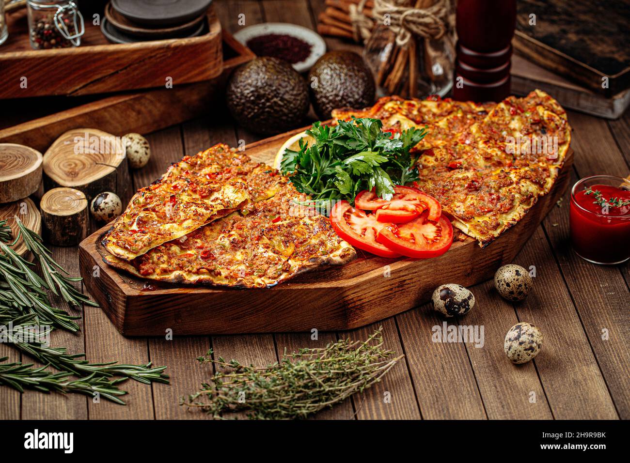 Turkish lahmacun pizza with mince and tomatoes Stock Photo