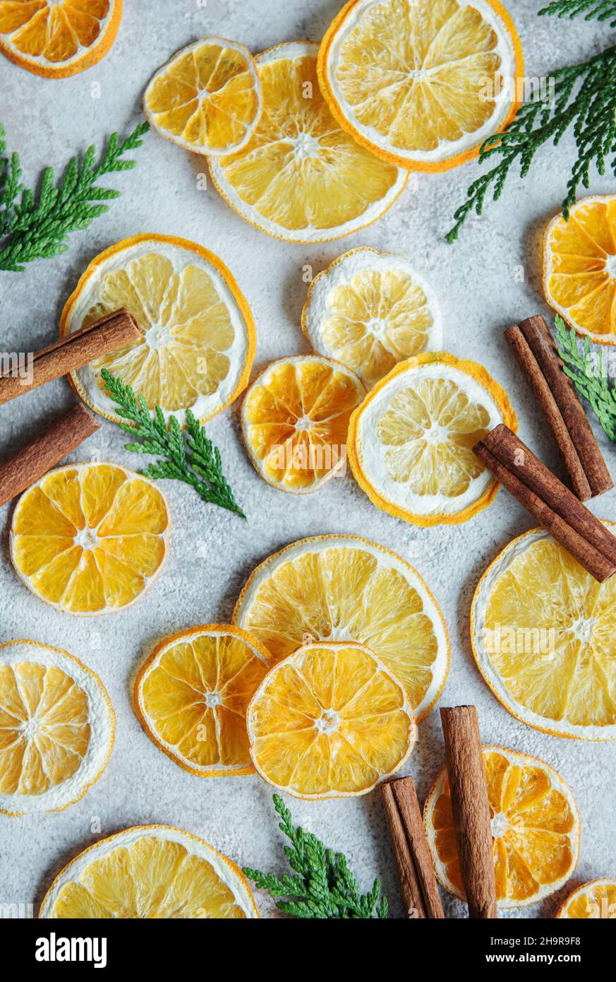 Arrangement of dry oranges and cinnamon sticks. Christmas holiday background Stock Photo