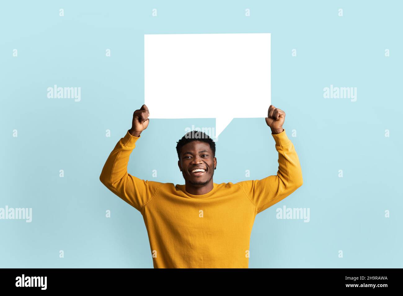 Cheerful black man holding empty communication chart Stock Photo