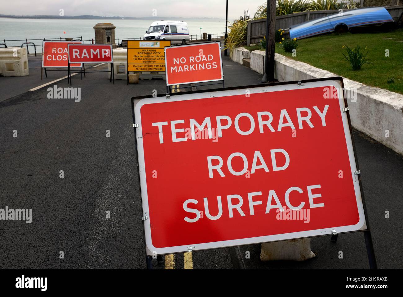 line,of,temporary,surface,warning,sign,road,works,work,tarmac, Stock Photo