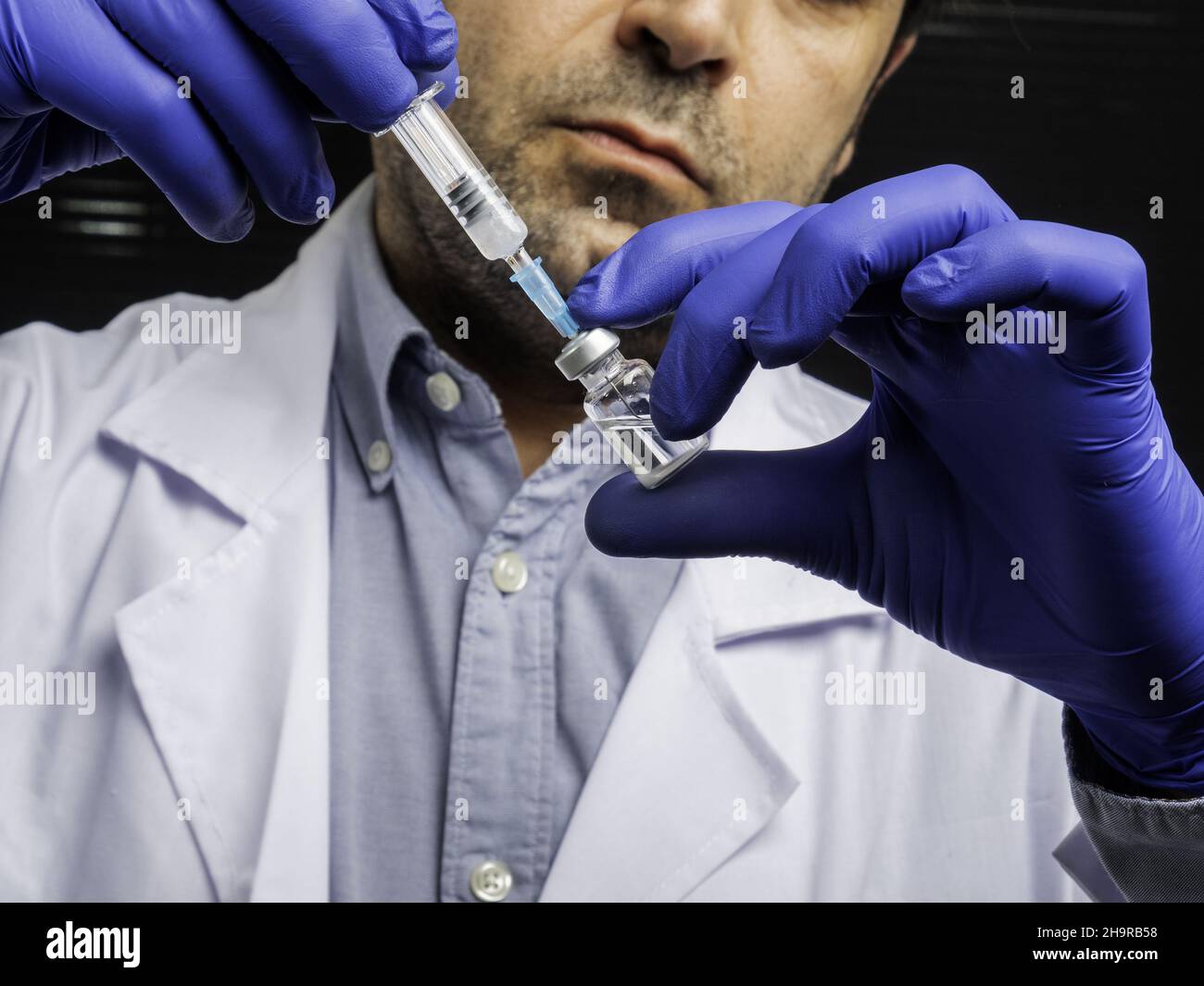Doctor ampoule vaccine in hi-res stock photography and images - Alamy