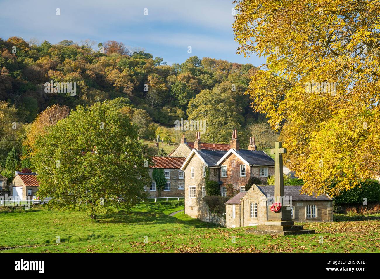 Autumn leaves and stone cottages at moorland village Hutton Le Hole, The North Yorkshire Moors, England. Stock Photo