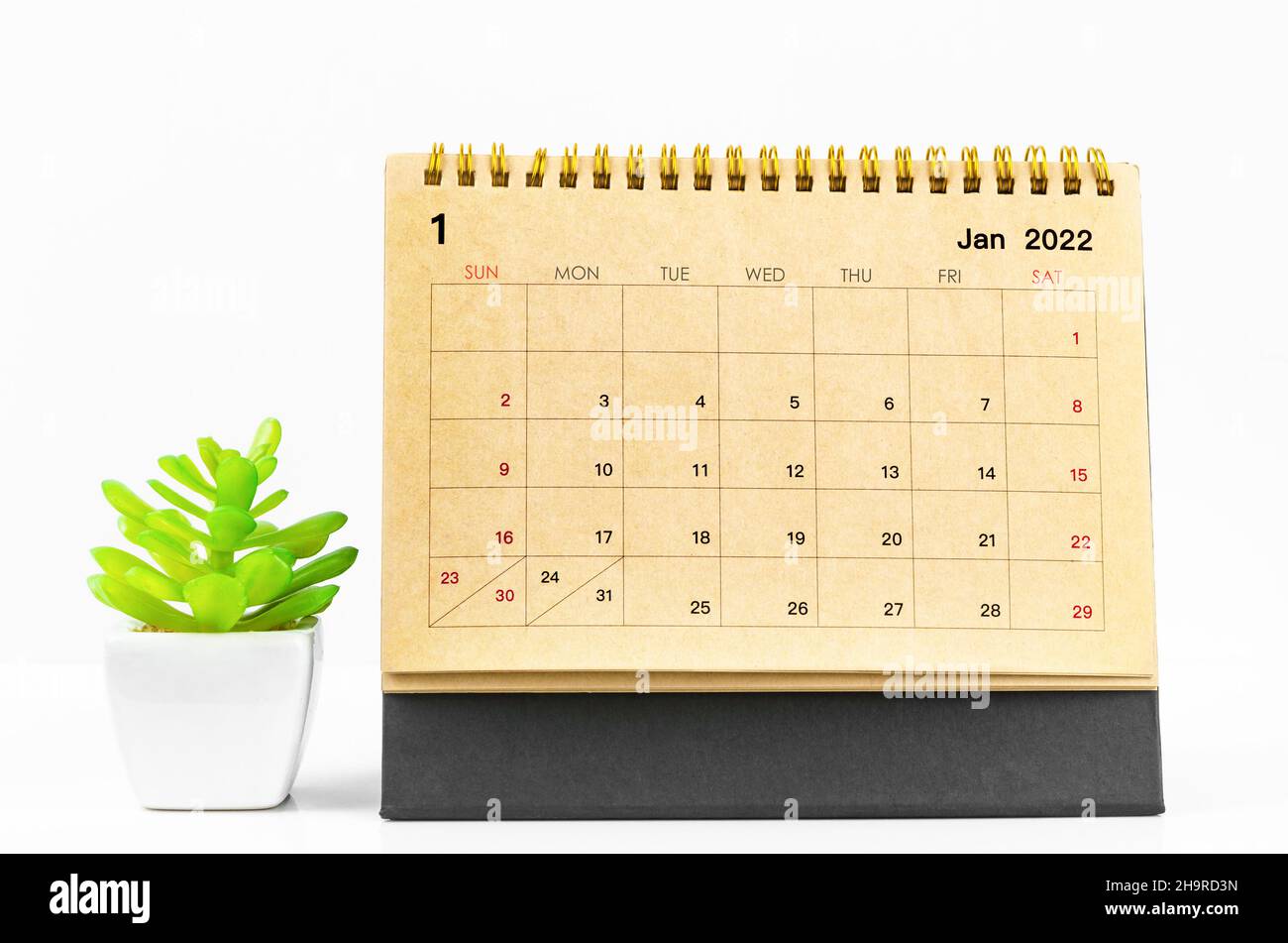 The January 2022 desk calendar on white table Stock Photo Alamy