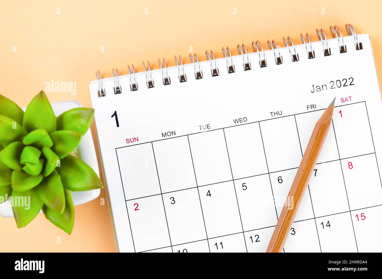 The January 2022 desk calendar with wooden pencil Stock Photo - Alamy