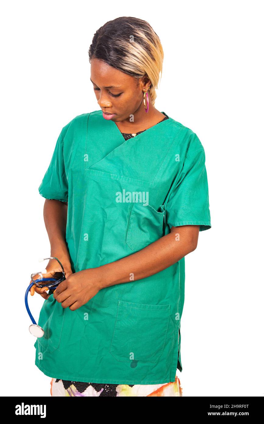 beautiful young serious woman putting the stethoscope in her pocket. Stock Photo