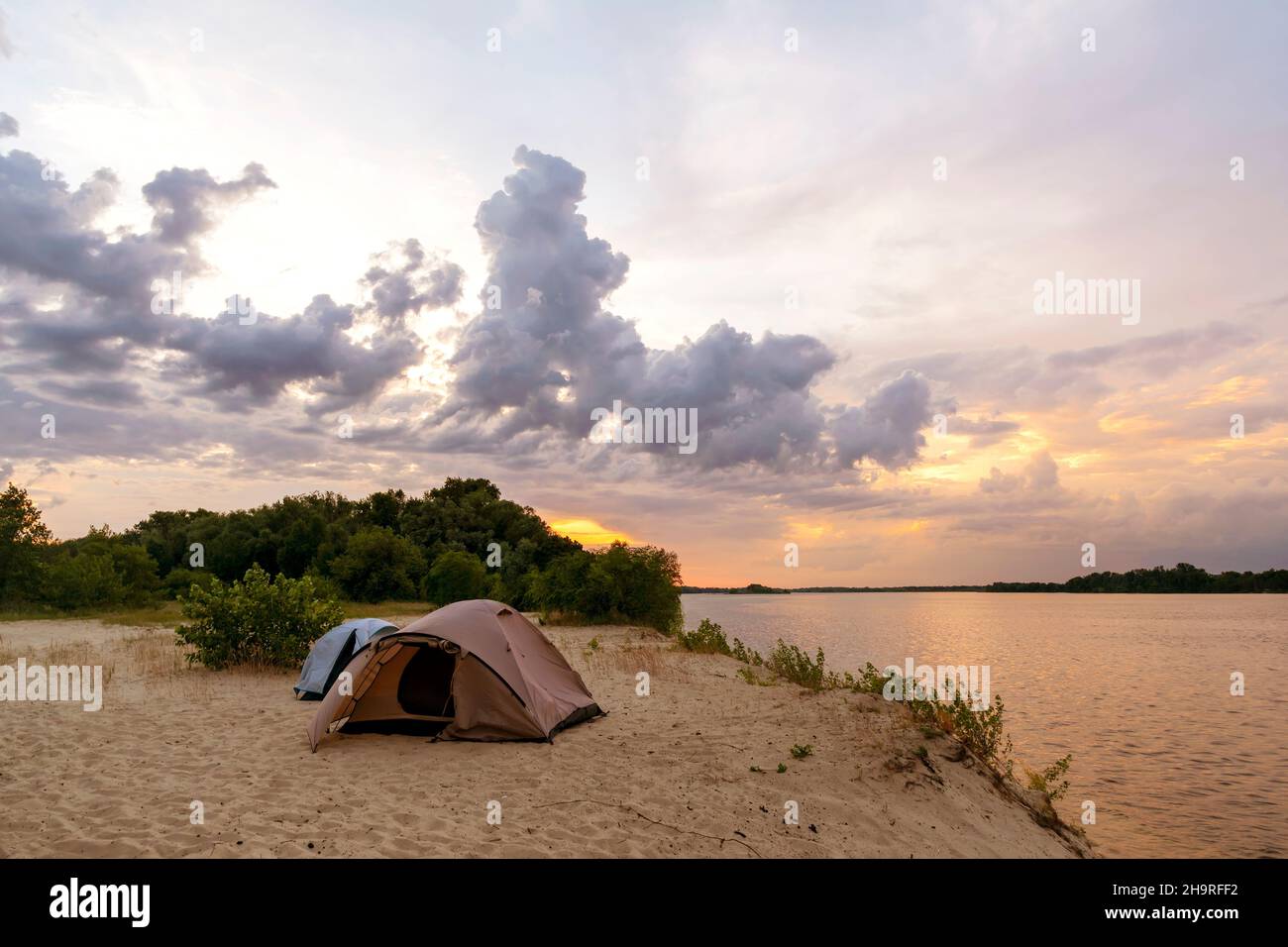 Camping tent in a camping on the river bank Stock Photo - Alamy